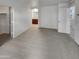 Large carpeted bedroom with adjacent bath/closet and lots of natural light from the windows at 7720 W Pipestone Pl, Phoenix, AZ 85035
