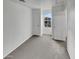 A bright room with neutral carpet and a window at 7720 W Pipestone Pl, Phoenix, AZ 85035