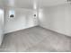 Clean bedroom with bright windows and neutral carpeting at 7720 W Pipestone Pl, Phoenix, AZ 85035