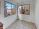 Bright dining area with tile floors and lots of natural light from surrounding windows at 7720 W Pipestone Pl, Phoenix, AZ 85035