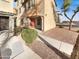 Charming townhome with desert landscaping and sidewalk leading to entry at 7720 W Pipestone Pl, Phoenix, AZ 85035