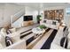 Bright living room with modern furnishings, stylish decor, and a cozy atmosphere at 7720 W Pipestone Pl, Phoenix, AZ 85035