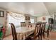 Formal dining area with classic wooden chairs, a large table, and natural lighting at 8531 N 37Th Ave, Phoenix, AZ 85051
