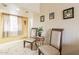 Inviting seating area with chair and decorative table with views of the window and natural light at 8531 N 37Th Ave, Phoenix, AZ 85051