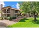 Inviting exterior view of the condo complex with well-manicured lawns and mature trees at 8700 E Mountain View Rd # 2058, Scottsdale, AZ 85258