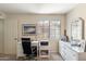 Office space with white furniture, neutral walls and a large window overlooking backyard at 8700 E Mountain View Rd # 2058, Scottsdale, AZ 85258
