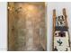 Shower with tiled walls, glass door and decoratives ladder on the wall at 8700 E Mountain View Rd # 2058, Scottsdale, AZ 85258