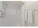 Bright white shower stall including shower head, soap dish, towel bar, and shower curtain at 9088 E Winchcomb Dr, Scottsdale, AZ 85260