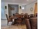 Elegant dining room featuring a large wooden table with upholstered chairs and decor at 9207 W Sells Dr, Phoenix, AZ 85037