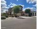 Attractive two-story home showcases a landscaped front yard, two-car garage, and a welcoming covered porch at 9207 W Sells Dr, Phoenix, AZ 85037
