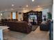 Spacious living room with comfortable leather seating and large entertainment center at 9207 W Sells Dr, Phoenix, AZ 85037