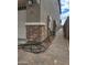 Side yard of house showing a walkway, house number, and utilities access at 9207 W Sells Dr, Phoenix, AZ 85037