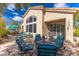 Charming outdoor patio with comfortable seating areas, perfect for relaxing and enjoying the beautiful backyard setting at 9475 N 115Th Pl, Scottsdale, AZ 85259