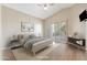 Staged bedroom featuring wood floors, slider doors, high ceilings and neutral colors at 9475 N 115Th Pl, Scottsdale, AZ 85259