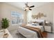 Staged bedroom with modern decor, a bed, side tables, and a window at 9475 N 115Th Pl, Scottsdale, AZ 85259