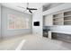 Bedroom features a ceiling fan, built-in storage, desk and mini-fridge at 9475 N 115Th Pl, Scottsdale, AZ 85259