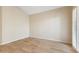 Empty bedroom features wood floors, neutral colors and plantation shutters at 9475 N 115Th Pl, Scottsdale, AZ 85259
