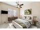 Staged bedroom with a bed, side tables, and modern decor at 9475 N 115Th Pl, Scottsdale, AZ 85259