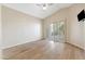 Spacious bedroom features a high ceiling, plantation shutters, and wood flooring at 9475 N 115Th Pl, Scottsdale, AZ 85259