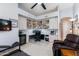 Bedroom featuring an integrated office space with custom cabinets, a television, and comfortable seating at 9475 N 115Th Pl, Scottsdale, AZ 85259