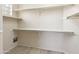 Walk-in closet with hardwood floor, built-in shelves and storage space at 9475 N 115Th Pl, Scottsdale, AZ 85259