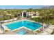 Stunning community pool area with palm trees, lounge chairs, and a spacious pool, creating a resort-like atmosphere at 9475 N 115Th Pl, Scottsdale, AZ 85259