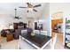 Bright dining area with hardwood floors, open layout, and views into the adjacent kitchen and living room at 9475 N 115Th Pl, Scottsdale, AZ 85259