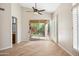 Dining area with sliding glass doors to the patio, wood floors and plantation shutters at 9475 N 115Th Pl, Scottsdale, AZ 85259
