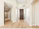 Bright foyer features wood floors, high ceilings, and a decorative glass front door at 9475 N 115Th Pl, Scottsdale, AZ 85259