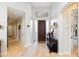 Bright foyer with hardwood floors, high ceilings, and a decorative front door with transom window at 9475 N 115Th Pl, Scottsdale, AZ 85259