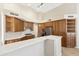 Kitchen features breakfast bar, stainless appliances, custom cabinetry with ample storage at 9475 N 115Th Pl, Scottsdale, AZ 85259