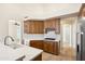 Beautiful kitchen with custom wood cabinetry, marble countertops, and open floorplan at 9475 N 115Th Pl, Scottsdale, AZ 85259