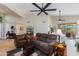 Spacious living room with hardwood floors, vaulted ceiling, and sliding glass doors to patio at 9475 N 115Th Pl, Scottsdale, AZ 85259