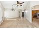 Open-concept living area with light wood floors, high ceilings, and seamless flow to kitchen at 9475 N 115Th Pl, Scottsdale, AZ 85259