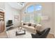 Bright living room boasts vaulted ceilings, large windows, and a neutral color palette at 9475 N 115Th Pl, Scottsdale, AZ 85259