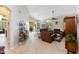 Spacious living room with hardwood floors, fireplace, vaulted ceiling, and sliding glass doors to patio at 9475 N 115Th Pl, Scottsdale, AZ 85259