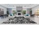 Stylish lounge area with cozy seating, decorative fireplace, and scenic views, perfect for relaxing or gathering at 9475 N 115Th Pl, Scottsdale, AZ 85259