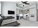 Staged home office with built-in desk, shelves, chair, and treadmill at 9475 N 115Th Pl, Scottsdale, AZ 85259