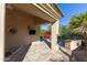 Covered outdoor patio with a built-in grill and a television at 9475 N 115Th Pl, Scottsdale, AZ 85259