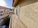 View of the wooden balcony showing the building's exterior and the railing around the outdoor space at 10249 N 12Th Pl # 2, Phoenix, AZ 85020