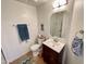 Clean bathroom with light walls, stylish mirror, and dark wood vanity at 10249 N 12Th Pl # 2, Phoenix, AZ 85020