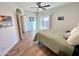 Light-filled bedroom with wood-look floors, a sliding glass door, and neutral decor for a relaxing ambiance at 10249 N 12Th Pl # 2, Phoenix, AZ 85020