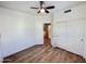 Bedroom features wood-look floors, closet with sliding doors, and a view through the door at 10249 N 12Th Pl # 2, Phoenix, AZ 85020