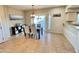 Bright dining area with modern chandelier and view of the patio, conveniently situated by the kitchen at 10249 N 12Th Pl # 2, Phoenix, AZ 85020