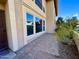 Inviting front entrance featuring brick pavers, desert landscaping, and views of the two-story townhome at 10249 N 12Th Pl # 2, Phoenix, AZ 85020