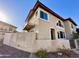 Exterior view of a two-story townhome featuring a private balcony and desert-friendly landscaping at 10249 N 12Th Pl # 2, Phoenix, AZ 85020