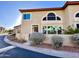 Inviting two-story townhome featuring desert landscaping and a cozy front entryway with a private patio at 10249 N 12Th Pl # 2, Phoenix, AZ 85020