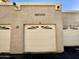 Two car garage with a concrete exterior and the address number above the middle garage door at 10249 N 12Th Pl # 2, Phoenix, AZ 85020