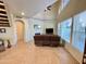 Inviting living room with a high ceiling, tiled floors, fireplace, and natural light at 10249 N 12Th Pl # 2, Phoenix, AZ 85020