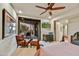 Bedroom with ceiling fan, comfortable seating and sliding doors to a private patio at 10567 E Fernwood Ln, Scottsdale, AZ 85262